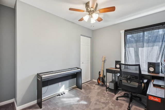 office space featuring baseboards, carpet floors, and ceiling fan