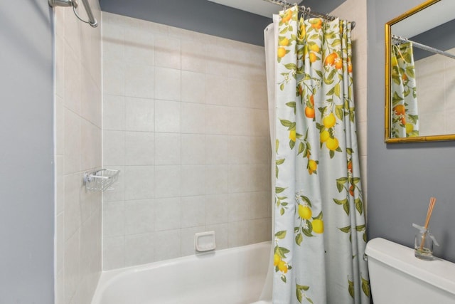 bathroom featuring shower / bath combination with curtain and toilet