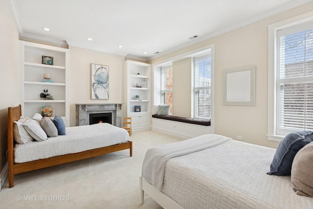 bedroom with ornamental molding, multiple windows, and visible vents