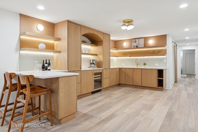 kitchen featuring decorative backsplash, open shelves, light wood-type flooring, and beverage cooler