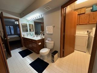 bathroom featuring vanity, toilet, and visible vents