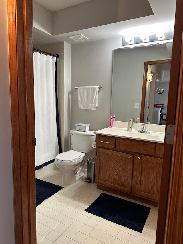 full bathroom featuring tile patterned floors, visible vents, toilet, and vanity