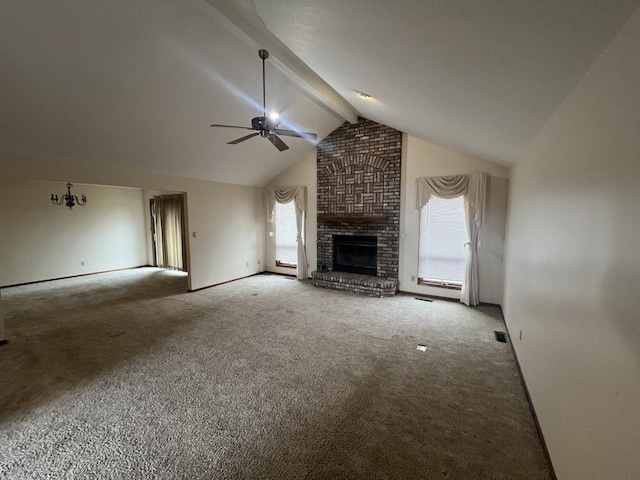 unfurnished living room with visible vents, a ceiling fan, a brick fireplace, beamed ceiling, and carpet