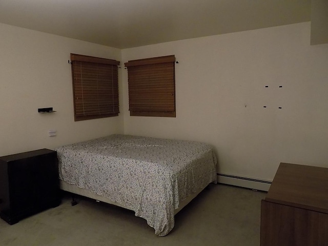 bedroom featuring carpet and a baseboard radiator