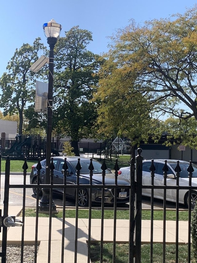 view of gate with fence