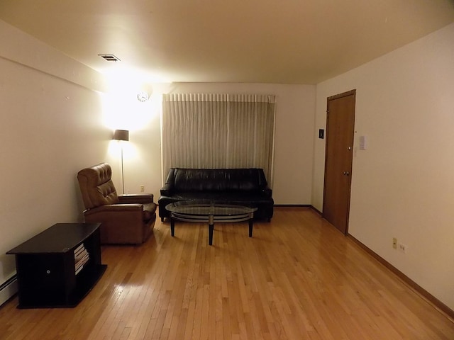 sitting room with visible vents and light wood-style flooring