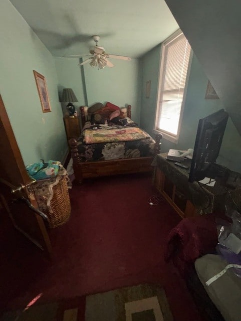 bedroom with ceiling fan and carpet flooring