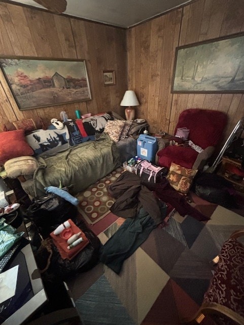 bedroom featuring wooden walls