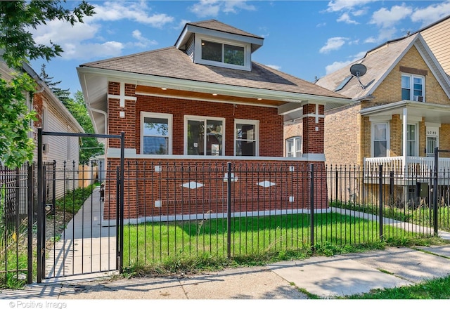 view of front of house with a fenced front yard, covered porch, brick siding, and a gate