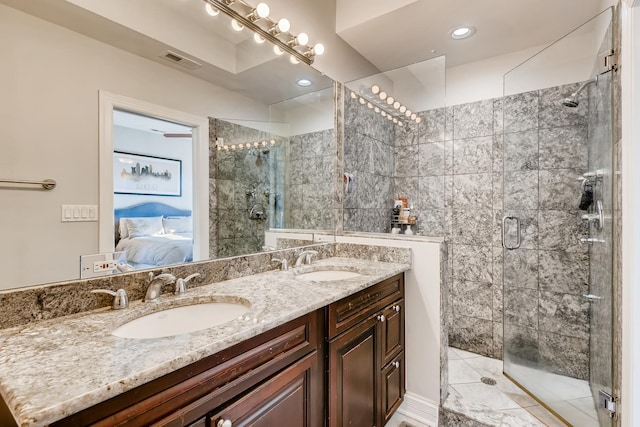 full bath with a sink, visible vents, a stall shower, and ensuite bath