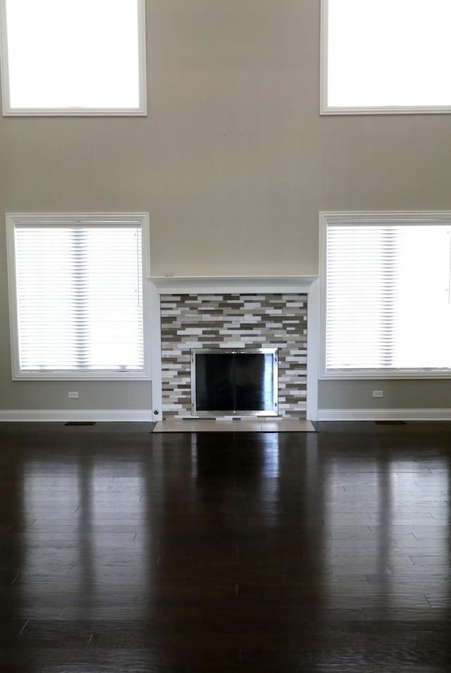1860 Lake Charles Dr, Vernon Hills, IL 60061 - unfurnished living room featuring a fireplace and wood finished floors