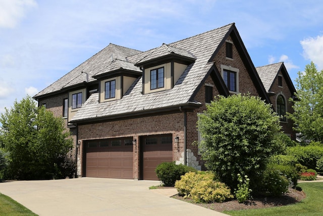 1860 Lake Charles Dr, Vernon Hills, IL 60061 - view of home's exterior featuring brick siding, concrete driveway, and a garage