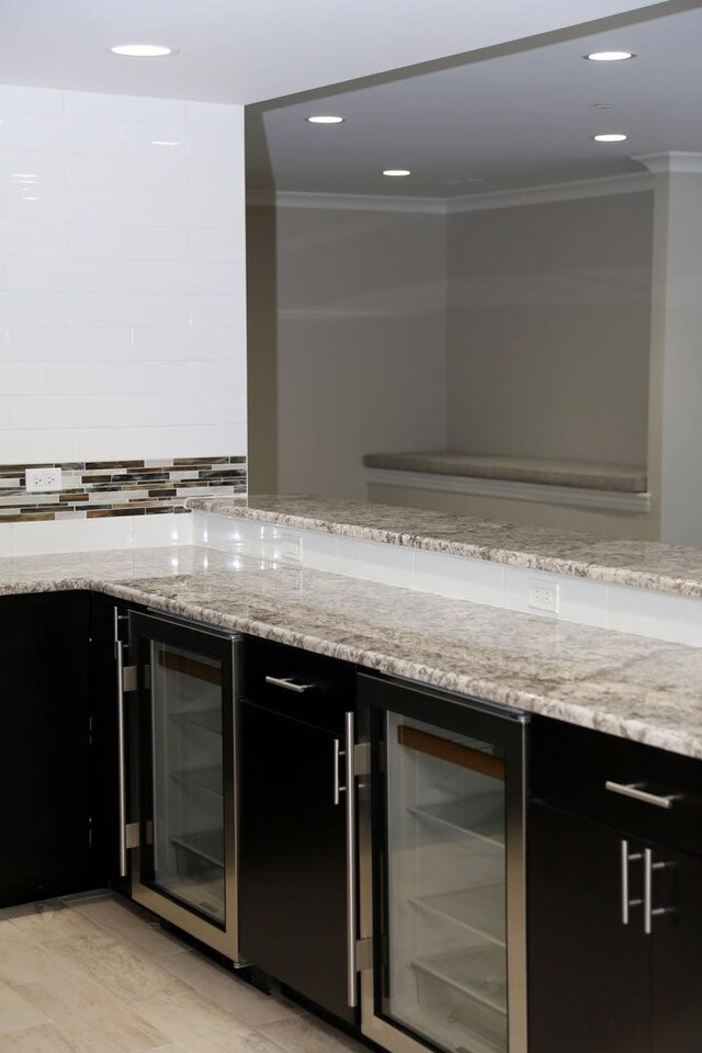 1860 Lake Charles Dr, Vernon Hills, IL 60061 - bar featuring wine cooler, crown molding, decorative backsplash, and recessed lighting