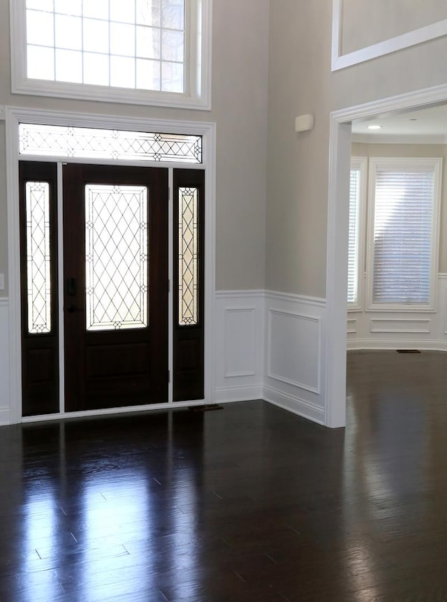 1860 Lake Charles Dr, Vernon Hills, IL 60061 - entrance foyer with wainscoting, a decorative wall, plenty of natural light, and wood finished floors