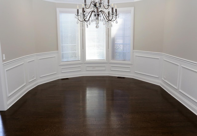 1860 Lake Charles Dr, Vernon Hills, IL 60061 - unfurnished dining area featuring a chandelier, a wainscoted wall, dark wood-style floors, and a decorative wall