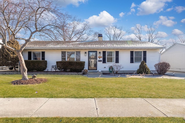 single story home with a front yard and a chimney