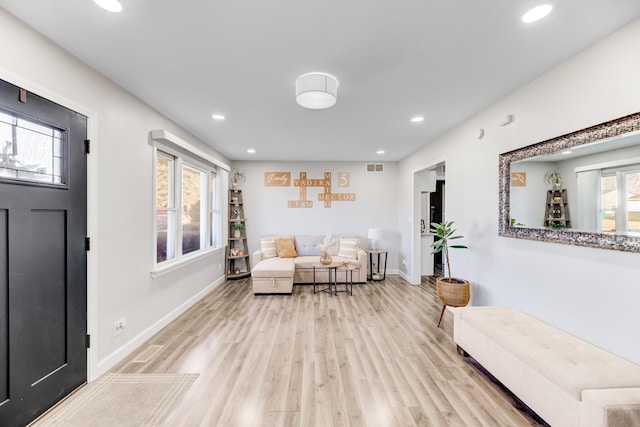 foyer entrance with visible vents, recessed lighting, baseboards, and wood finished floors