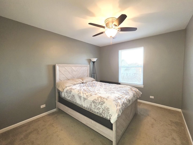 bedroom with baseboards, carpet, and ceiling fan