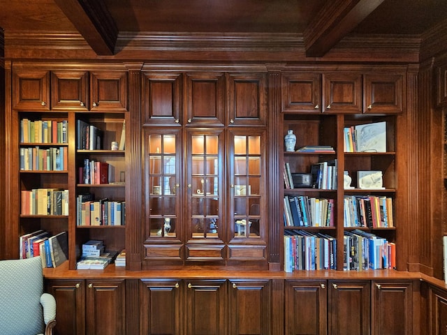 office view of beam ceiling, ornamental molding, and built in features