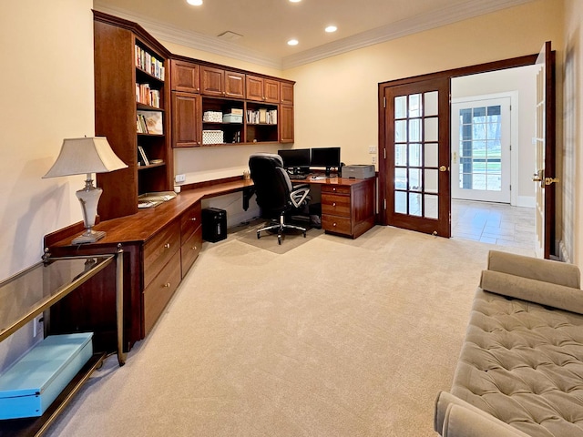 office space featuring ornamental molding, recessed lighting, light carpet, and built in study area