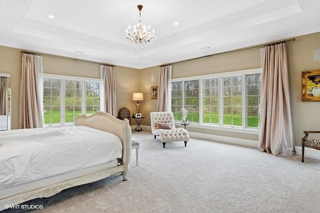 bedroom with a tray ceiling, a chandelier, carpet floors, ornamental molding, and recessed lighting