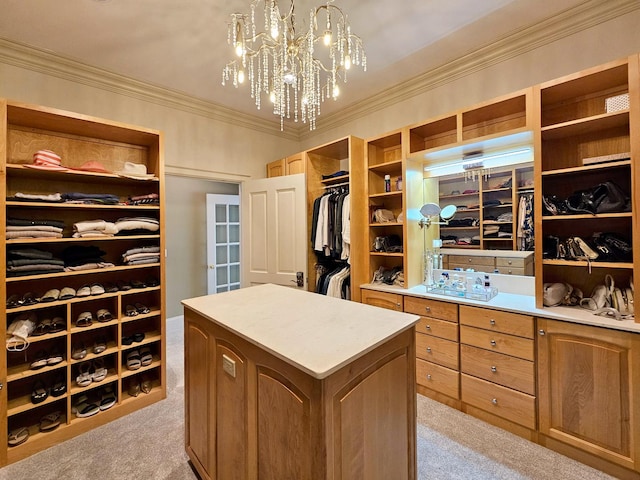 walk in closet featuring light carpet and a chandelier
