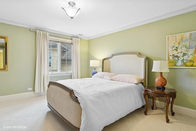 carpeted bedroom featuring ornamental molding and baseboards