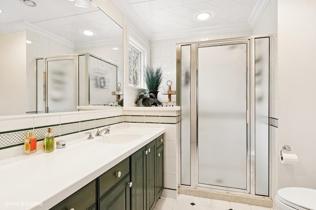 full bathroom with ornamental molding, a stall shower, vanity, recessed lighting, and toilet