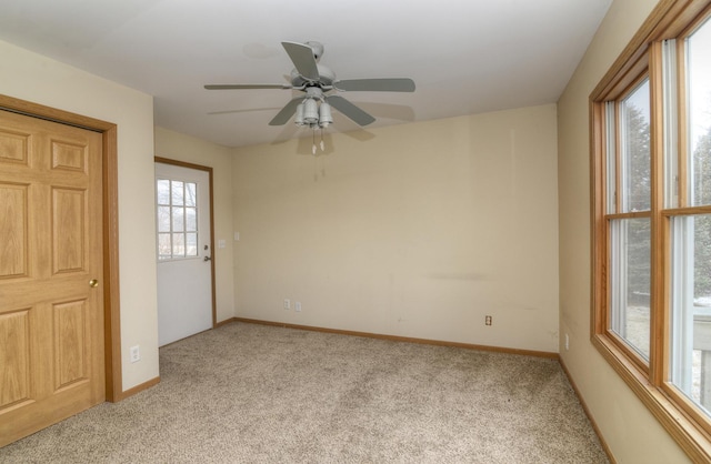 spare room with carpet flooring and baseboards