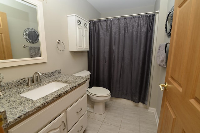 bathroom with tile patterned floors, toilet, vanity, and a shower with curtain