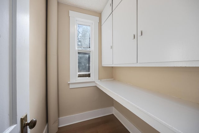 interior details with wood finished floors and baseboards