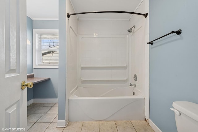 bathroom with tile patterned flooring, baseboards, shower / washtub combination, toilet, and ornamental molding