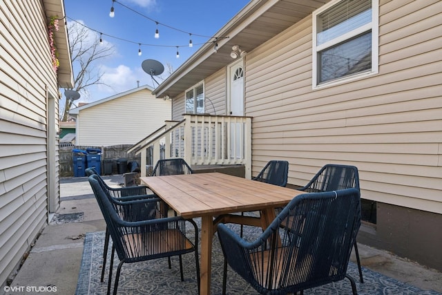 view of patio / terrace with outdoor dining area and fence