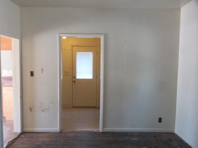 spare room featuring baseboards