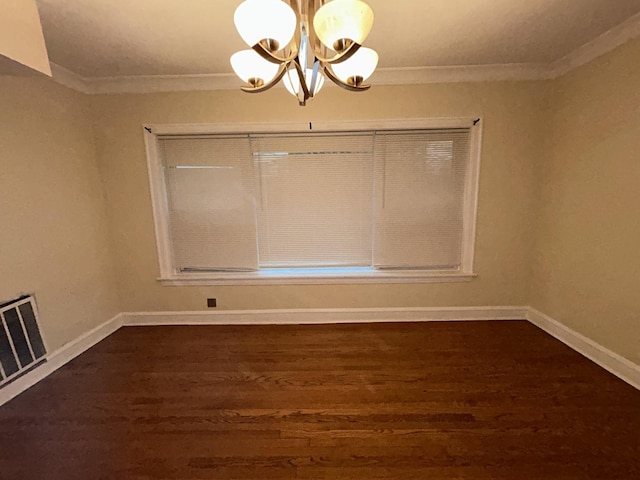 unfurnished dining area featuring dark wood finished floors, visible vents, and crown molding