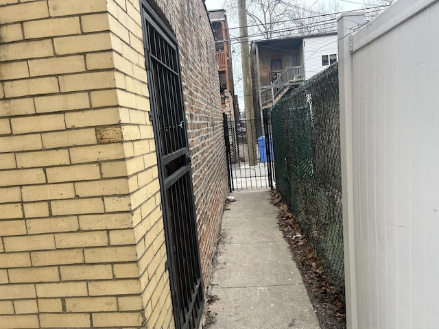 view of property exterior with a gate and fence