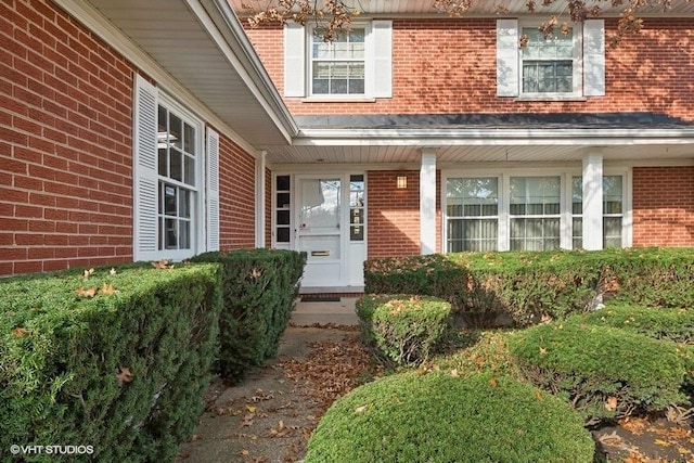 property entrance with brick siding