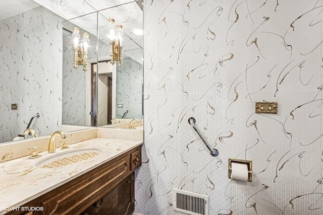 bathroom featuring visible vents and vanity