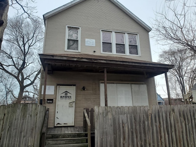 view of front of home with fence