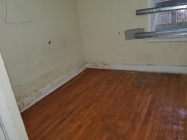 spare room with hardwood / wood-style flooring