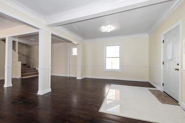 entryway with ornamental molding, stairway, and wood finished floors