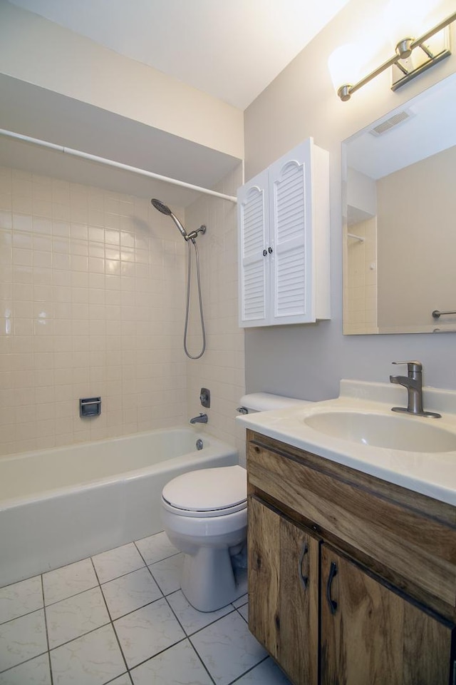 bathroom with vanity, toilet, washtub / shower combination, and visible vents