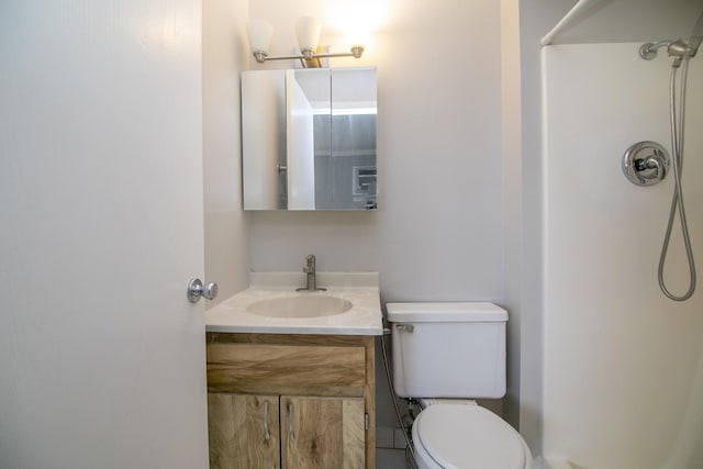 bathroom with a shower, toilet, and vanity