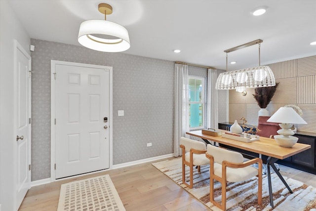 dining space with recessed lighting, light wood-style flooring, baseboards, and wallpapered walls