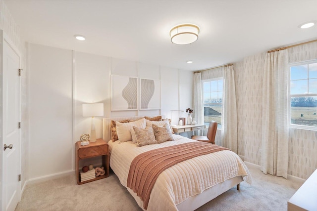 bedroom featuring recessed lighting, light colored carpet, and baseboards