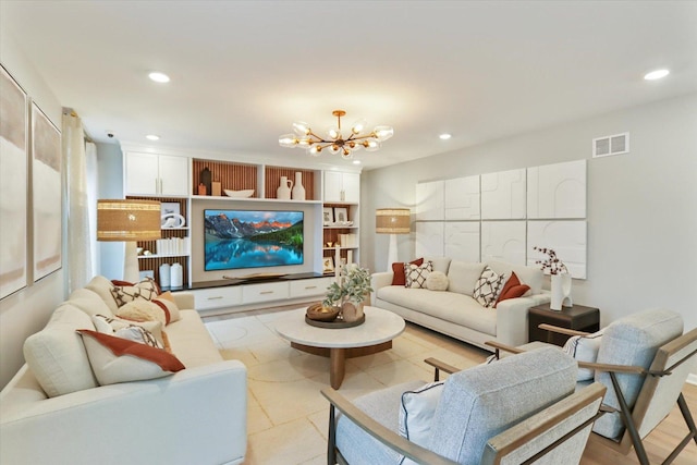 living room featuring visible vents, a notable chandelier, and recessed lighting