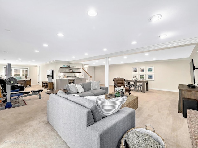 living area featuring stairway, light colored carpet, ornamental molding, recessed lighting, and a bar