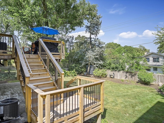 view of yard with stairway, cooling unit, a wooden deck, and fence