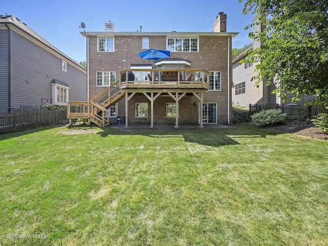 back of house featuring brick siding, a chimney, and a fenced backyard