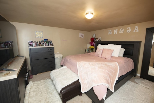 bedroom with light colored carpet